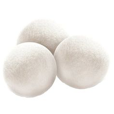 three white wool balls on a white background