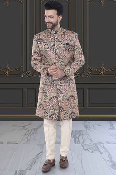 This multi-color sherwani for men is a versatile addition to any wardrobe. Crafted with precision, its unique design showcases expert tailoring and a blend of vibrant colors, making it perfect for any occasion. Express your personal style with confidence and make a statement wherever you go. Traditional Multicolor Fitted Kurta, Designer Long Multicolor Kurta, Elegant Multicolor Traditional Drape Kurta, Multicolor Long Designer Kurta, Designer Long Sleeve Beige Sherwani, Long Multicolor Resham Embroidery Kurta, Designer Beige Kurta For Festive Occasions, Designer Fitted Kurta For Groom, Unstitched Multicolor Kurta With Naqshi Detailing