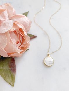 "DESCRIPTION: The MAE Necklace - Mother of Pearl round coin pendant on a dainty gold filled chain. We love this classic + minimalist look and we think you will too! Whether purchasing for yourself or for a dear loved one, this beautiful necklace is sure to become a staple piece in any accessories collection! MATERIALS: Chain, Clasp, Jump Rings - Gold Filled Pendant - Gold Plated, Mother of Pearl PENDANT SIZE: Approximately 3/4\" in diameter PACKAGING: Your necklace will arrive on a Dainty Doe si Opal Moon Necklace, Silver Jewelry Cleaner, Star And Moon Necklace, Mother Of Pearl Pendant, White Jewelry Box, Anniversary Gift For Wife, Mother Of Pearl Necklace, Dainty Gold Necklace, Graduation Gifts For Her