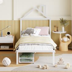 a white bed sitting in a bedroom on top of a hard wood floor next to a table