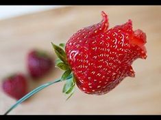 a close up of a strawberry on a table