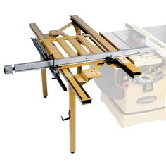 a table sawing machine on top of a work bench