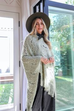 **This product is shipped by a third party warehouse within the US and may arrive separately from your complete order. This is the perfect poncho for a chilly day! The soft, cozy fabric will keep you warm while the cute scallop lace detail adds a touch of style. You'll love wearing this poncho with jeans and boots or dress it up with a skirt and heels. #lovemyleto Imported Cozy Winter Poncho With Fringe, Cozy Shawl Poncho For Spring, Winter Open Knit Poncho, Cozy Knit Cape Poncho, Cozy One Size Shawl Cape, Cozy One-size Shawl Cape, Cozy Shawl In Cape Style One Size, Winter Crochet Long Sleeve Poncho, Fall Crochet Knit Poncho