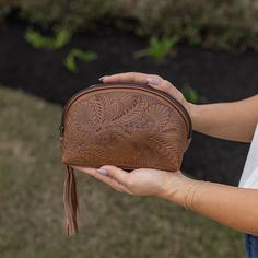 "What makes this so special is that it is a high quality imported leather that has a beautiful, natural sheen, and SOFT leather feel whose durability will last years to come. Many leathers from other countries are hard and stiff. This Paraguayan leather has been perfectly tanned to be soft and supple and will become even softer the older it becomes.  These leather bags and purses are uniquely created ONE AT A TIME by expert leather artisans in Itaugua, Paraguay. Roomy triangle shaped design fits Brown Coin Purse For Everyday Use, Leather Clutch With Zipper Pouch, Artisan Style Bag With Removable Pouch, Soft Leather Coin Purse For Daily Use, On-the-go Soft Leather Wallet, Daily Use Soft Leather Coin Purse, Brown Coin Purse For Gift, Brown Hand Tooled Pouch, Brown Leather Cosmetic Bag With Removable Pouch