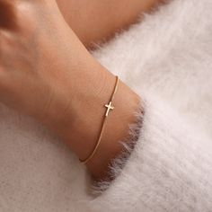 Celebrate faith and elegance with our Gold Cross Bracelet. This mini cross bracelet is a beautiful symbol of devotion, making it an ideal gift for various religious milestones and special occasions. Whether it's a baptism, first communion, birthday, or Christmas, this bracelet is a timeless keepsake. - Cross Nameplate Bracelet one of the most loved designs by our customers. - Great Dainty necklace as Valentines Day gift, Christmas Gift, birthday gift, mothers day gifts or any special occasion. - Elegant Cross Pendant Bracelet As A Gift, Elegant Cross Rosary Bracelet As Gift, Elegant Rosary Bracelet With Cross For Gift, Elegant Personalized Cross Bracelets, Spiritual Cross Bracelet For First Communion, Gold Cross Bracelet For Baptism, Elegant Personalized Bracelets For Confirmation, Spiritual Cross Bracelets For Baptism, Adjustable Cross Bracelets For First Communion