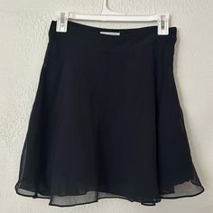 Black Mini A-Line Skirt Flowy And Pretty Never Worn!! Hidden Zipper On The Side 14 Inch Waist Black A-line Skort With Lined Skirt, Black A-line Lined Skort, Urban Outfitters Flowy Lined Skirt, Urban Outfitters Black Mini Skort, Chic Lined Mini Skirt By Urban Outfitters, Fitted Black Skort By Urban Outfitters, Chic Lined Mini Skirt From Urban Outfitters, Chic Lined Skirt By Urban Outfitters, Chic Party Skirt From Urban Outfitters