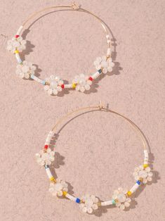 Welcome springtime blooms with the White Flower Power Beaded Hoop Earrings! Spring Hoop Earrings With Flower Charm, Spring Beaded Flower Earrings For The Beach, Spring Beach Flower Beaded Earrings, Multicolor Beaded Flower Earrings For Spring, Spring Flower Hoop Earrings, Spring Multicolor Beaded Flower Earrings, Spring Bohemian Colorful Beaded Earrings, Bohemian White Beaded Earrings For Spring, Summer Flower Charm Hoop Earrings