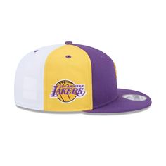 The Los Angeles Lakers Front Logoman 9FIFTY Snapback features an embroidered Lakers themed NBA Logoman at the front panels with a snapback closure at the rear. Additional details include a team logo patch at the right-wear side, a team color crown, a purple visor, and a gray undervisor. Throwback Snapback Fitted Hat For Game Day, Throwback White Hat For Streetwear, Snapback Fitted Hat With Letter Patch For Sports Events, Fitted Snapback Hat With Letter Patch For Sports Events, Collegiate Six-panel Snapback Hat For Streetwear, Streetwear Snapback Hat With Team Logo, Fitted Snapback Hat With Logo Patch For Fans, Throwback White Snapback Hat, White Throwback Snapback Hat