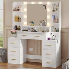 a white vanity with lights on it in a room