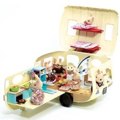 an open suitcase filled with toys on top of a table