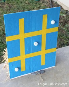 a cardboard board game with the words backyard carnival games sticky tic tac toe