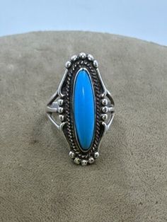 Vintage Ted OTT Native American Sterling Silver Turquoise Ring size 6. Top measures 30mm x 13mm. Stone is 21mm x 5mm. Weighs 6.3g Southwestern Style Blue Round Ring, Oval Nickel-free Blue Turquoise Ring, Classic Adjustable Turquoise Ring, Collectible Round Turquoise Ring, Southwestern Style Blue Nickel-free Rings, Blue Oval Cabochon Collectible Rings, Vintage Blue Cabochon Turquoise Ring, Vintage Blue Turquoise Cabochon Ring, Classic Turquoise Rings Collectible