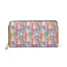 a multicolored zip around wallet with cats and flowers on the front, in white