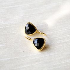 This beautiful pair of Earring has natural black onyx embedded in 925 sterling silver, and Gold Plated to a high shine. This pair matches with your every outfit to give you a classy and elegant look.  Upgrade your accessory collection today with this must have piece today.  D E T A I L S - material : sterling silverstone : Natural Black Onyxpolish : gold polishedfinish : smooth and polished to a high shineS H I P P I N G & P R O D U C T I O N - My current production time is 2-6 business days Elegant Black Faceted Earrings, Black Faceted Earrings As A Gift, Faceted Black Earrings Gift, Black Single Earring For Wedding, Classic Onyx Earrings Gift, Elegant Onyx Earrings For Party, Onyx Drop Earrings For Party, Onyx Gemstone Earrings For Gifts, Elegant Adjustable Faceted Crystal Earrings