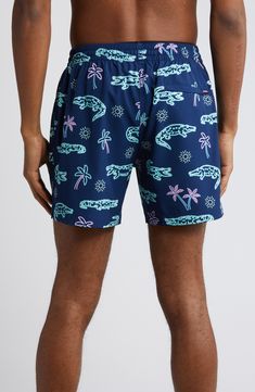 Lightweight and perfectly stretchy, these lined swim trunks move easily in the water and dry quickly on land for comfort no matter where you take them. 5 1/2" inseam; 22" leg opening; 11" front rise; 14 1/2" back rise (size Medium) Lined 92% polyester, 8% spandex Machine wash, tumble dry Imported Beachwear Swimwear With Built-in Shorts For Outdoor, Relaxed Fit Swimwear With Built-in Shorts For Surfing, Navy Swimwear With Built-in Shorts, Navy Swimwear With Built-in Shorts For Vacation, Navy Swim Trunks With Built-in Shorts For Beach, Relaxed Fit Swimwear With Elastic Waistband For Outdoor, Outdoor Swimwear With Elastic Waistband And Relaxed Fit, Relaxed Fit Swim Trunks With Built-in Shorts, Navy Swim Trunks With Built-in Shorts For Vacation