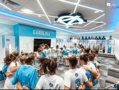 the girls soccer team huddle together in the locker room before their match against north carolina