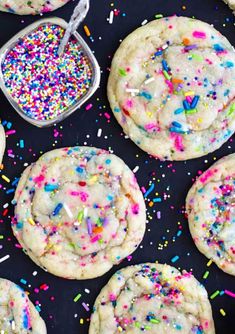 sprinkles and sugar on top of white cookies with colorful sprinkles