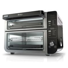 a black and silver toaster oven with its door open