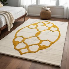 a white and yellow area rug in a bedroom