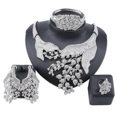 A metal platted stone upholstered jewelry set for party or wedding purposes. A shining jewelry set that attracts everyone's eye towards you enhances your beauty. the stone adds a shining effect to the jewelry. A piece is bound to get praised because of its beauty-enhancing quality. Features Material: Metal, Stone Style: Trendy Fine or Fashion: Fashion Item Type: Jewelry Sets Occasion: party Shape\pattern: Plant Jewelry Sets: gold plated What Includes 1 X Necklace set (1necklace, 1pair of earring Elegant Alloy Necklaces For Evening, Dazzling Hand-set Jewelry Sets For Evening, Elegant Alloy Jewelry With Sparkling Stones, Dazzling Hand Set Jewelry Sets For Evening, Dazzling Evening Jewelry Sets Hand Set, Dazzling Hand Set Jewelry For Evening, Wedding Jewelry Sets With Rhinestones, Gold Alloy Jewelry With Sparkling Stones, Glamorous Diamond Evening Jewelry Sets