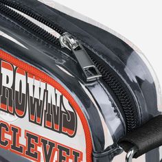 Over your shoulder and off to the game. Whether you're running errands on the town or running the tailgate in the parking lot, this Cleveland Browns Repeat Retro Print Clear Crossbody Bag is the perfect way to carry the team like never before. Features Repeat Cleveland Browns current and retro team logo and wordmark displays on sides of bag, in case there were any doubts where your allegiances lie Woven, team-colored crossbody strap that makes carrying the team easy and convenient Repeat team wo Sporty Rectangular Game Day Bag, Sporty Bags For Football Season, Sporty Shoulder Bag With Cell Phone Pocket For Sports, Sporty Rectangular Shoulder Bag For Sports Events, Sporty Crossbody Shoulder Bag For Sports Events, Retro Print, Cleveland Browns, National Football League, Parking Lot