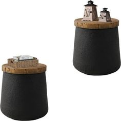 two small black and brown lighthouses on top of each other