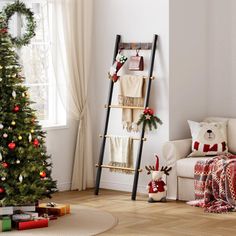 a living room with a christmas tree and decorations