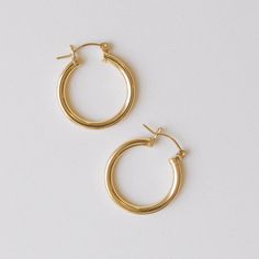 At 25mm, these hoops are our most statement earrings to date. The Statement Honey Hoops are a timeless statement piece and can be worn as a daily sample. They are also so fun to pair with another one of our gold earring pairs. - 25mm 14k Gold-Filled hoops - 3mm thickness - Waterproof, Non-Tarnish, Hypoallergenic - Handcrafted with love from San Clemente, California Classic Small Hoop Earrings In 14k Gold Filled, Classic 14k Gold Filled Hoop Earrings For Anniversary, Classic Everyday Gold Hoop Earrings, Classic Everyday 14k Gold Filled Hoop Earrings, Tarnish Resistant 14k Gold Filled Hoop Earrings, 14k Gold-filled Tarnish-resistant Hoop Earrings, 14k Gold Filled Tarnish Resistant Hoop Earrings, Classic Small Hoop 14k Gold Filled Earrings, 14k Gold Filled Earrings For Everyday