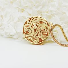 Inspired by Yun Boutique logo, this Auspicious Flower pendant embraced ancient Chinese filigree jinlay art with classic modern elegance. Adjustable chain can be styled with difference collar shapes. Not to be confused with regular gold plating, our vermeil is a thick layer of 18k solid gold on sterling silver. Chinese filigree inlay art is a delicate kind of jewelry metalwork, usually of twisted threads made of gold, silver, and copper, soldered together and arranged in artistic motifs with moun Elegant Gold-plated Medallion Jewelry, Fusion Style Round Pendant Jewelry For Wedding, Elegant Round Medallion Necklace Gift, Fusion Style Round Pendant Wedding Jewelry, Fusion Round Pendant Wedding Jewelry, Fusion Style Round Pendant For Wedding, Elegant Round Pendant Medallion Necklace As Gift, Elegant Round Pendant Medallion Necklace For Gift, Luxury Filigree Medallion Necklaces