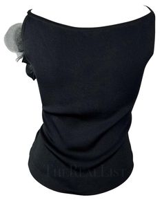 For Sale on 1stDibs - TheRealList presents: a fabulous black knit Yves Saint Laurent tank top. From the 1990s, this top features a scoop neckline, spaghetti straps, and a large The 1990s, Floral Applique, Black Knit, Large Black, Scoop Neckline, Black Floral, Yves Saint Laurent, Spaghetti Strap, Saint Laurent