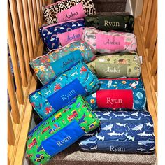 a stair case filled with lots of personalized pillows