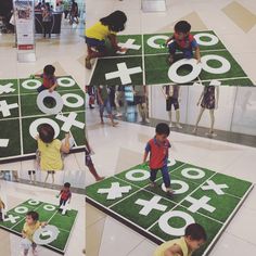 children playing with giant numbers on the floor