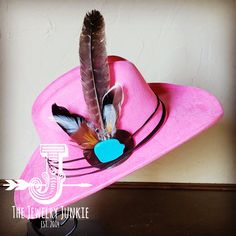 If you’re looking for the perfect accessory to complement your favorite boho style, look no further. The Boho-Style Western Felt Hat w/r Hat Band Accent by The Jewelry Junkie is absolutely everything that you need. Not only is it easy to incorporate into any and all outfits, but the genuine leather of the band immediately elevates whatever it is you’re wearing. The item that you receive in the mail will resemble the one in the picture but, because every piece by Jewelry Junkie is handmade, it wi Hat Bands, Large Feathers, Western Hat, Hat Fits, Leather Hat, Feather Hat, Ecommerce Website Design, Cowgirl Western, Blue Feather