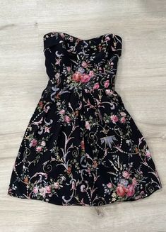 Betsy Johnson Black Silk Strapless Mini Dress Size 4 | eBay Floral Print Sundress Mini Dress For Evening, Evening Mini Dress With Floral Print, Black Strapless Sundress For Spring, Floral Print Strapless Mini Dress For Cocktail, Strapless Lined Sundress Mini Dress, Strapless Floral Print Corset Dress, Strapless Black Dress For Casual Occasions, Strapless Floral Print Mini Dress For Cocktail, Chic Strapless Floral Print Casual Dress