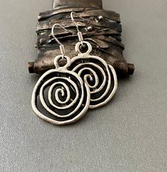 Modern and light weight. Love these awesome spirals! They go with anything...perfect gift for your pal gal Silvertone zinc alloy....lead and nickel free Sterling silver ear wires Gift boxed Thanks for stopping by - please see my shop for more genuine southwest designer jewelry! https://www.etsy.com/shop/ManyBeadsOfSedona Nickel Free Spiral Earrings For Everyday, Nickel-free Spiral Earrings For Everyday, Everyday Spiral Nickel-free Earrings, Everyday Nickel-free Spiral Earrings, Nickel-free Spiral Minimalist Earrings, Minimalist Spiral Nickel-free Earrings, Spiral Metal Jewelry With Oxidized Finish, Minimalist Spiral Nickel-free Jewelry, Nickel-free Black Spiral Jewelry