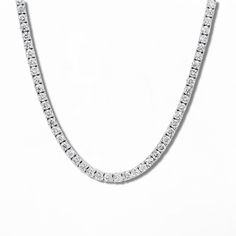 At 16in in length, this tennis necklace is the perfect subtle statement for those who like to keep it dainty. It features 3mm stones and double-clasp closure. Everyday Luxury Diamond White Tennis Necklace, Minimalist Round Diamond Tennis Necklace, Classic Diamond White Tennis Necklace For Everyday Luxury, Timeless Single Strand Diamond White Tennis Necklace, Minimalist Diamond Tennis Necklace, Minimalist Tennis Necklace With Diamond Accents, Minimalist Round Tennis Necklace With Diamond Accents, Diamond White Tennis Necklace For Everyday Luxury, Minimalist Silver Tennis Necklace With Diamond Cut