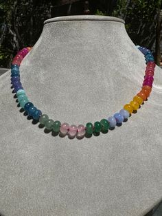 Embrace the ethereal beauty of a spectrum of colors with this stunning Ethereal Spectrum Gemstone Necklace. Featuring a harmonious blend of various gemstones, this necklace is perfect for those who love unique, eye-catching jewelry. Each bead is carefully selected to create a balanced and beautiful piece that will complement any outfit. Spiritual Multicolor Rondelle Beaded Necklaces, Rainbow Round Beads Necklace For Healing, Multicolor Beaded Rondelle Crystal Necklaces, Multicolor Beaded Rondelle Crystal Necklace, Handmade Multicolor Rondelle Crystal Necklaces, Rainbow Rondelle Necklace For Gift, Rainbow Rondelle Necklace Gift, Multicolor Beaded Agate Necklaces, Rainbow Beaded Necklaces With Natural Stones