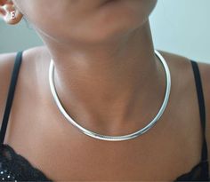 Very good quality sterling silver .925 smooth shiny finish choker, stylish and trendy. Add your Initial or initials as your family grows or make your whole name.( Ask for custom order if more than 1 letters) You are able to use a choker as a plain style also or add other charms to it. ( see pictures) Size Choker size is 4 mm x 16'' also on the model. COLORS Gold over silver, Sterling silver. Good gift for: Mother's day. Birthday, Baby shower New mom. Grandmother gift Mom in law gifts Christmas A In Law Gifts Christmas, Statement Engagement Ring, Elegant Choker, Necklaces Choker, Women Choker Necklace, Dainty Initial Necklace, Idea For Birthday, Rose Gold Plated Ring, Choker Jewelry