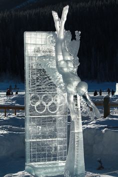 an ice sculpture is displayed in the snow