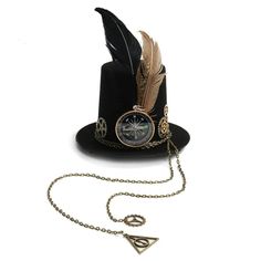 Don't underestimate this Mini Top Hat in a Dear Steampunk style. It will accompany any Victorian and steampunk outfit at your dressed-up or costumed events. Type: Mini hat Easy holding with integrated hair clips Material: polyester (durable, resistant, easy to wash and dry) Decoration: compass, feathers, and chains Want to add a touch of whimsy to your steampunk look? Check out our Steampunk Cat Ears Hat for a playful twist on classic style! Explore our full range of steampunk headwear for even Adjustable Punk Mini Hat For Cosplay, Vintage Hat For Cosplay, Vintage Hat Costume Accessories For Cosplay, Steampunk Adjustable Costume Hats And Headpieces, Steampunk Mini Hats For Halloween, Adjustable Punk Costume Accessories For Themed Events, Adjustable Punk Style Costume Accessories For Themed Events, Vintage Adjustable Costume Hat For Costume Party, Vintage Adjustable Costume Hats And Headpieces For Party