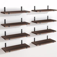 several wooden shelves with metal brackets on them