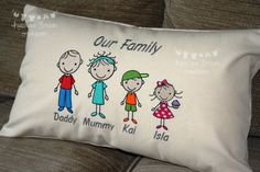 a family pillow on a couch with the words, our family daddy mommy kal isa