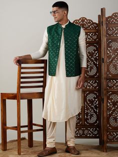 vastramay mens green embellished jacket and cream pleated kurta wirh pyjama set Festive Classic Long Sleeve Outerwear, Classic Long Sleeve Festive Outerwear, Tailored Festive Outerwear For Semi-formal Occasions, Tailored Festive Semi-formal Outerwear, Traditional Cotton Outerwear For Eid, Festive Cotton Stand Collar Outerwear, Festive Cotton Outerwear With Stand Collar, Fall Festive Nehru Jacket, Traditional Tailored Outerwear For Festive Season