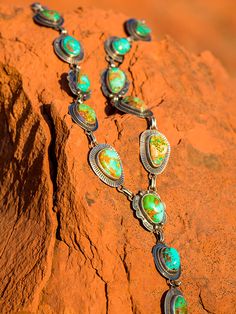 One of my favorite items to shoot. These necklaces showcase Royston turquoise, the most beautiful mix of ocean blue, forest greens and brilliant copper. The Artist link features 3 to 4 different bezel and concho design. They are all one of a kind and a custom order. I do layouts and include you in the process! Our stones are second to none, we go direct to the mine to choose. All of our Royston stones are hand-picked to create a unique, heirloom quality piece that you will enjoy for years to come. Prices may vary depending on stone size, so please contact us for specifics! I would love to design one just for you! Western Turquoise Jewelry With Patina, Southwestern Multi-stone Green Jewelry, Southwestern Green Multi-stone Jewelry, Southwestern Style Green Multi-stone Jewelry, Green Western Style Jewelry For Gift, One Of A Kind Southwestern Green Necklace, Unique Southwestern Green Necklace, Southwestern Green Necklace, Silver Turquoise Jewelry