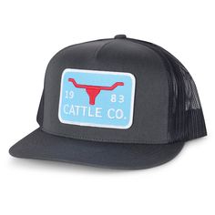 the cattle co trucker hat is black and has a red cow on it's front