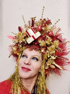 Get ready for Holiday party! Great addition to your "Ugly sweater" outfit or your holiday cocktail dress. Red and gold colored headdress will stand out from the crowd. Great for Christmas, New Year, halloween , Carnival, Masquerade, photoshoot and more... Decorated with beautiful poinsettia, in the middle wrapped up "presents", big and small balls, snowflaks, holiday decorations....Headdress size about 13x15 inch. Elastic in the back, fits most heads. Colors can be slightly different from the pi Masquerade Photoshoot, Ugly Sweater Outfit, Snowflake Crown, Ugly Sweater Outfits, Winter Crown, Funny Christmas Hats, Holiday Cocktail Dress, Christmas Headdress, Carnival Masquerade