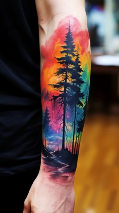 a man's arm with a colorful forest scene tattoo on the left forearm and right arm