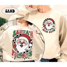 Paraprofessional Christmas Shirt Santa's Favorite Parapro, Christmas Parapro Sweatshirts, Teacher Aide, Para Team, Parapro Christmas Gifts ↓ Click here to view our additional fashionable collections ↓ https://handcraftedbyhelenn.etsy.com Product Details: - 100% Cotton (fiber content may vary for different colors) - Medium fabric (5.3 oz/yd2 (180 g/m2)) - Classic fit - Tear away label - Runs true to size Care instructions: - Machine wash: warm (max 40C or 105F); - Non-chlorine: bleach as needed; - Tumble dry: Medium - Do not iron; Do not dry clean ● Please choose your preferred style, size, and color from the dropdown menu or leave us a message in the "notes to seller" section. ● We are committed to processing and shipping your items as quickly as possible, but please note that custom print Paraprofessional Shirts, Teacher Aide, Teachers Aide, Yummy Desserts, Christmas Shirt, Cricut Projects, Christmas Shirts, Cotton Fiber, Custom Print