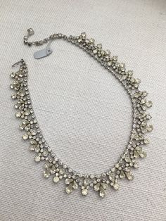 Stunning vintage diamante necklace in great condition. This is a vintage piece and therefore it is old. The clasp and all the stones and settings are in good condition. It is a lovely piece and there is only one of them. The length is slightly variable going from 37cm to 43cm. Please take the time to look at my other vintages pieces in my shop. Please read my POLICIES SECTION for shipping information. Www.etsy.com/uk/shop/heathertaylorstudio/policy Please visit my home page to see all the other Crystal Hair Pins, Neck Choker, Neck Chain, Crystal Choker, Square Diamond, Rhinestone Necklace, Diamond Design, Vintage Crystal, Vintage Jewellery