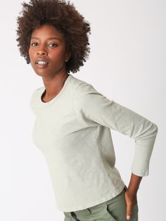 A wardrobe classic, our Faye long-sleeve tee is perfect to layer or wear on its own. Made from the softest cotton it will be a closet staple for you. We love it paired equally with our Easy Pant or Simone Skirt. Fabric: 100% Cotton . Color-way: Cool Sage. Model is 5'9" and wearing size small. Machine wash. Tumble dry on low. Made in the USA. Sweat Sets, Skirt Fabric, Wardrobe Classic, Sweaters And Leggings, Lifestyle Shop, New Set, Long Sleeve Tee, Jacket Tops, Sweater Hoodie